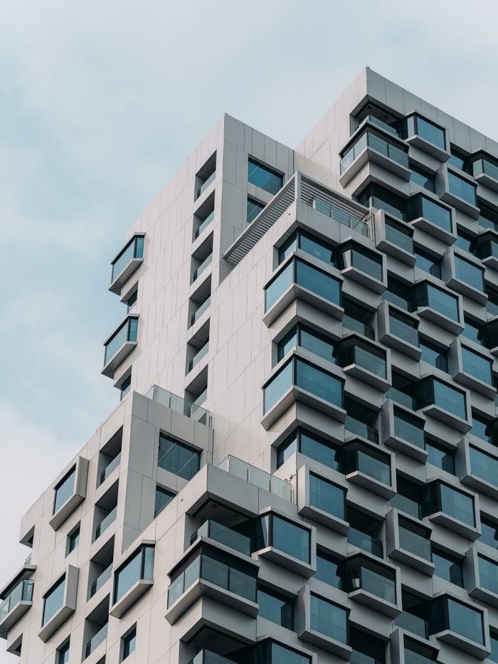Contemporary architectural design featuring protruding windows on a high-rise building.